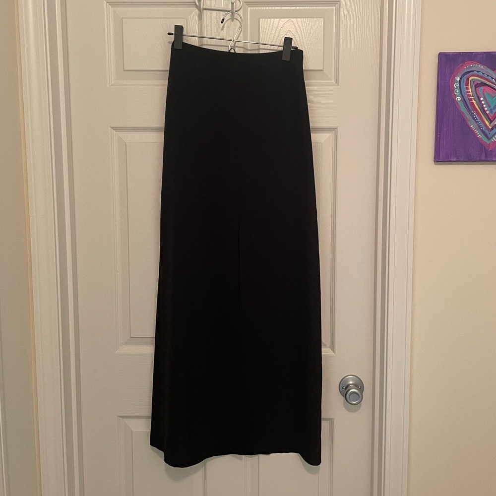 Black maxi skirt with front slit.